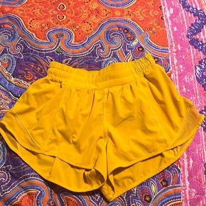 orangy yellow lulu shorts. size 4, 2.5 inch